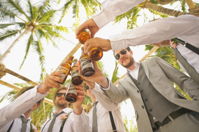 groomsmen celebrating by cheers